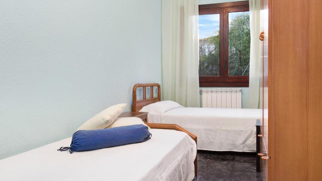Posteľ alebo postele v izbe v ubytovaní 2Maer - Blanes