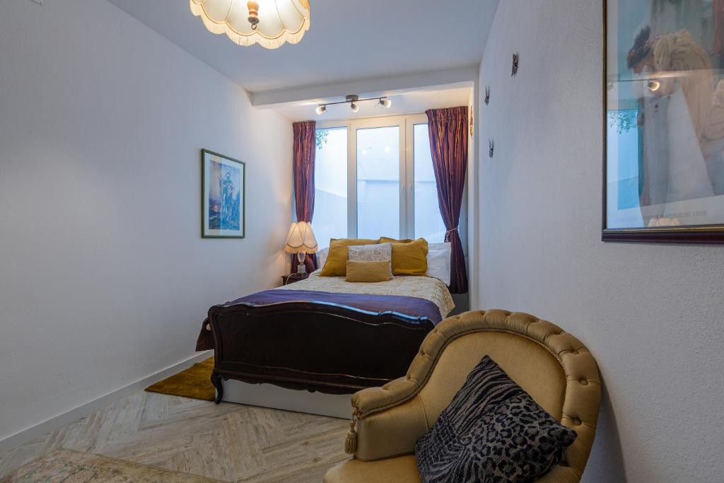 Ένα ή περισσότερα κρεβάτια σε δωμάτιο στο Romance & The City Lagos