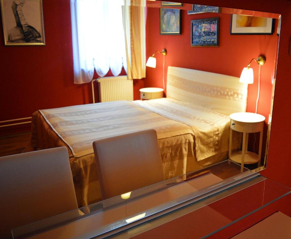 Postel nebo postele na pokoji v ubytování Hotel *** Plauter Kúria