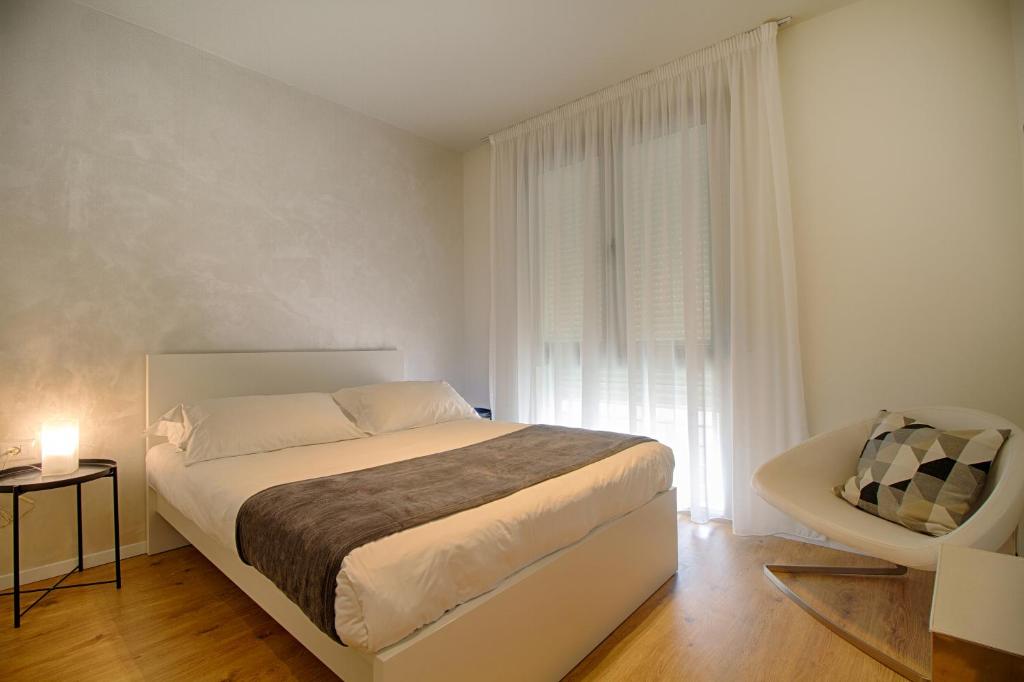 Postel nebo postele na pokoji v ubytování The Rooms Serviced Apartments Tirana