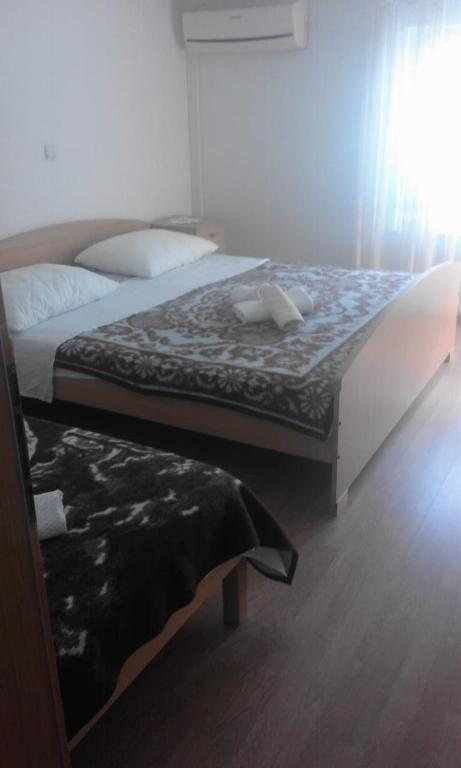 Postel nebo postele na pokoji v ubytování Apartments IVAN in Duce (900)