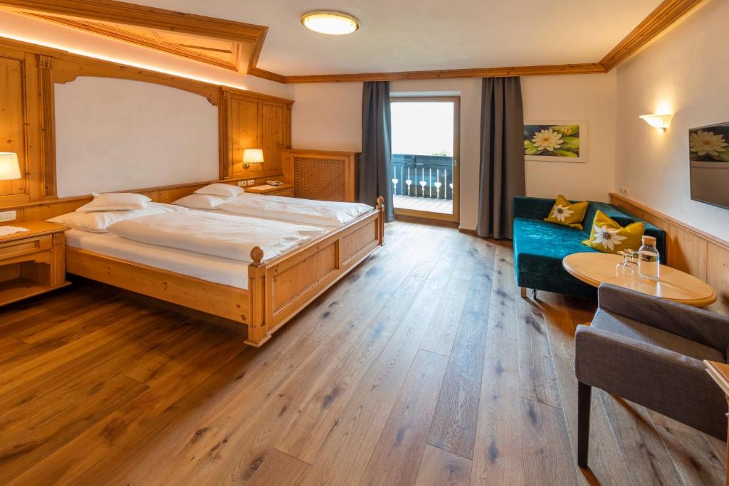 Postel nebo postele na pokoji v ubytování Hotel Schlosswirt