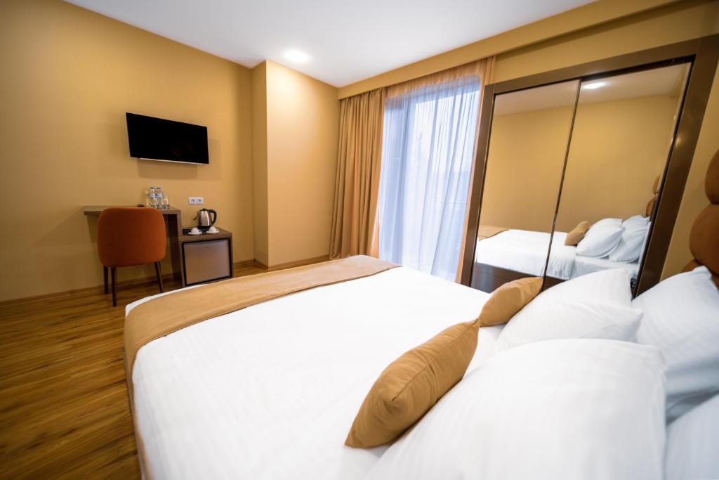 Postel nebo postele na pokoji v ubytování Hotel Residence Plaza