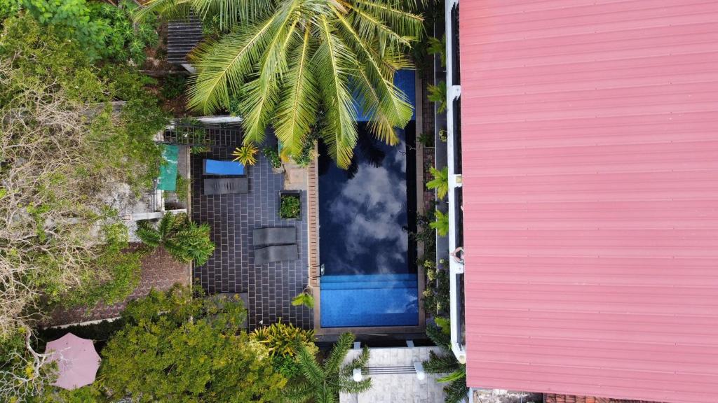 an overhead view of a blue door on a house at Serendib Village Guest House in Negombo