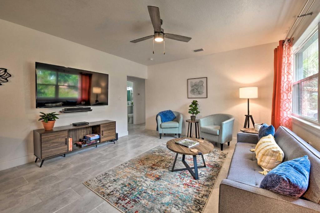 a living room with a couch and a tv at Bright, Pet-Friendly Retreat in Avon Park! in Avon Park