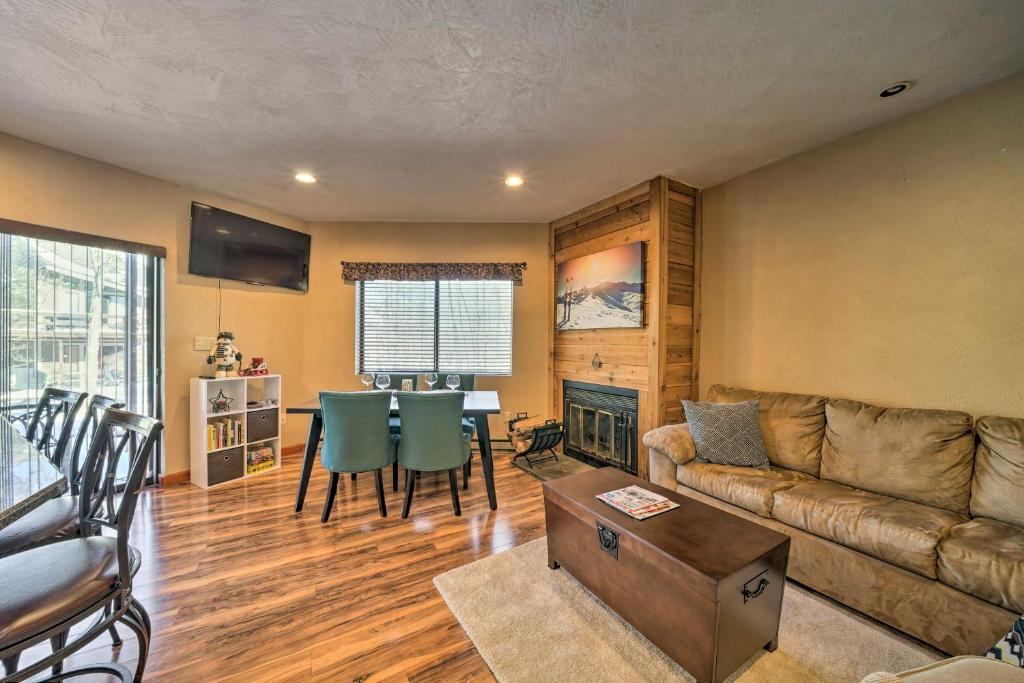 a living room with a couch and a table at Idyllic Somerset Condo Ski, Hike and Relax! in Champion
