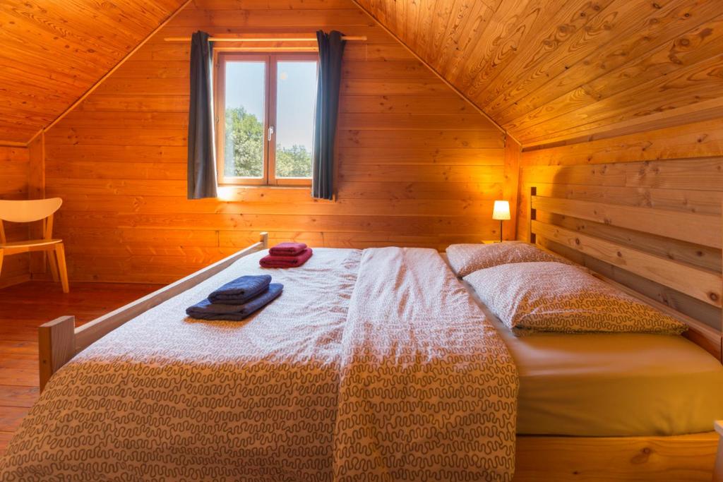Postel nebo postele na pokoji v ubytování Le Bois de Faral