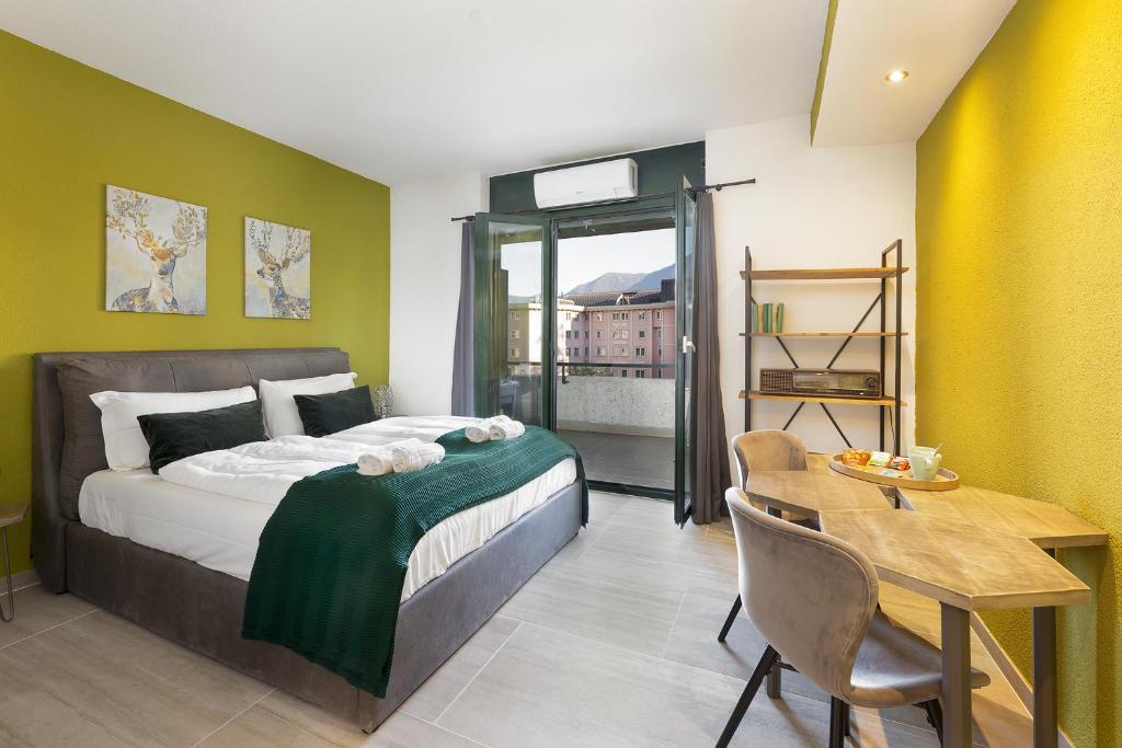 Postel nebo postele na pokoji v ubytování GuestHouse Lugano Apartments by LR