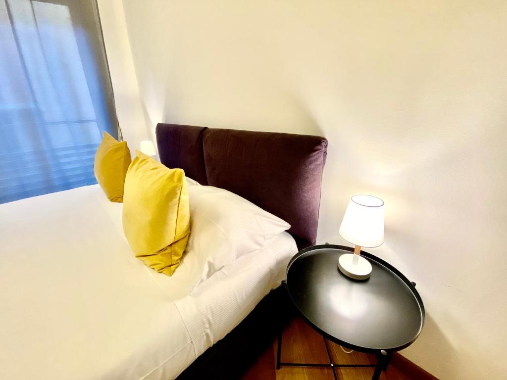 Postel nebo postele na pokoji v ubytování Palazzina B - Smart Rooms