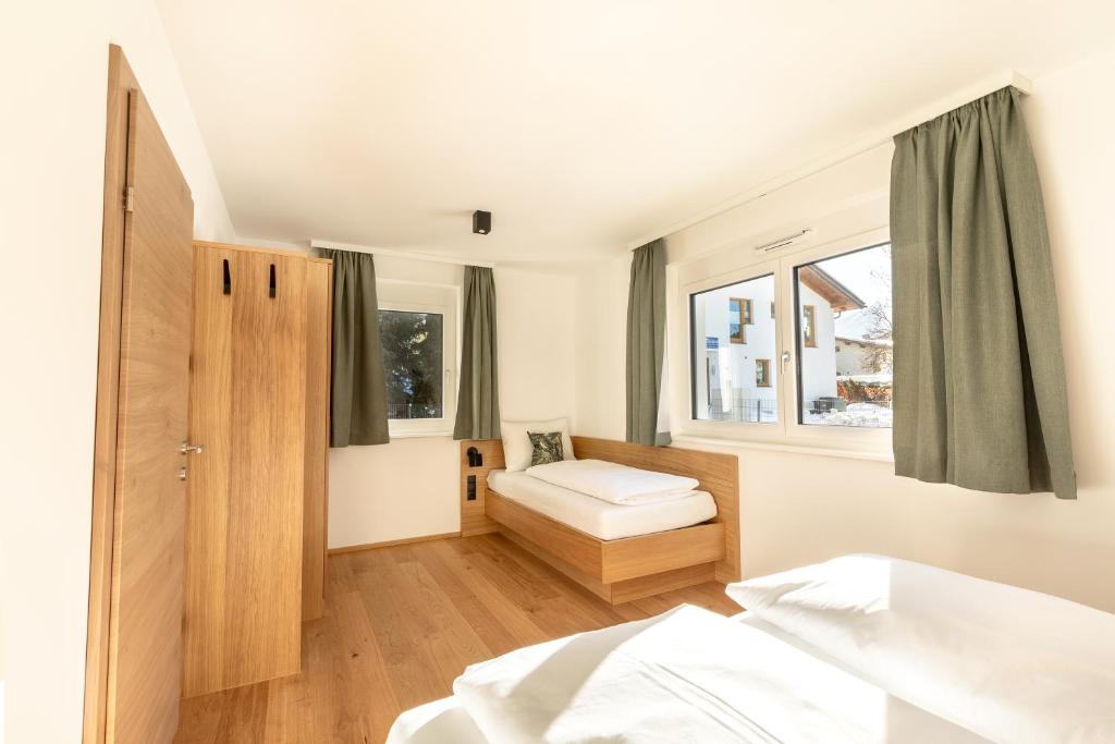 Posteľ alebo postele v izbe v ubytovaní LISAL Appartements