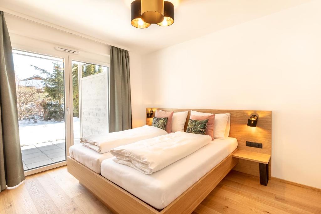 Posteľ alebo postele v izbe v ubytovaní LISAL Appartements