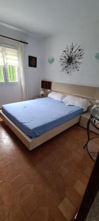 a bedroom with a large bed in a room at maison nathalia in Jávea