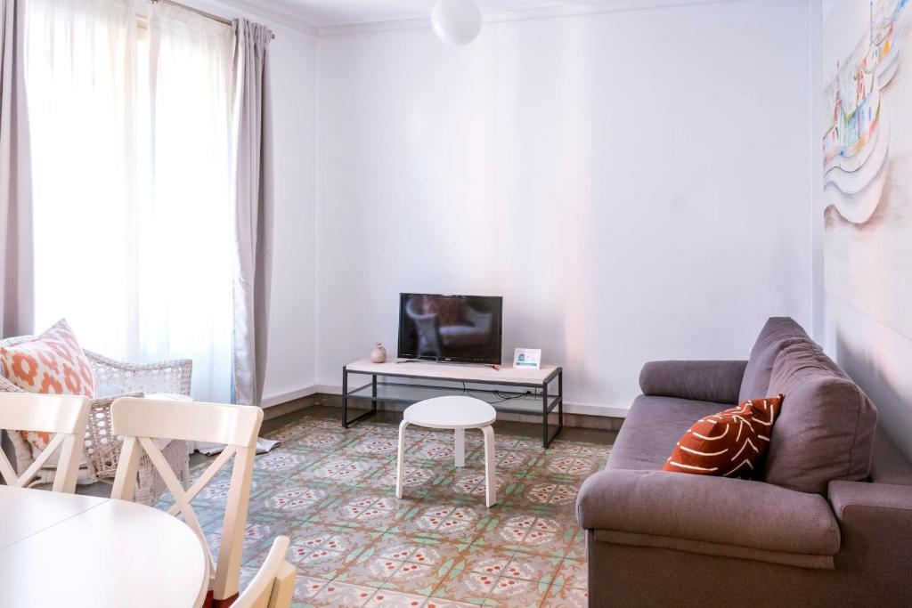 Televízia a/alebo spoločenská miestnosť v ubytovaní Casa Cosi - Sant Gervasi 3