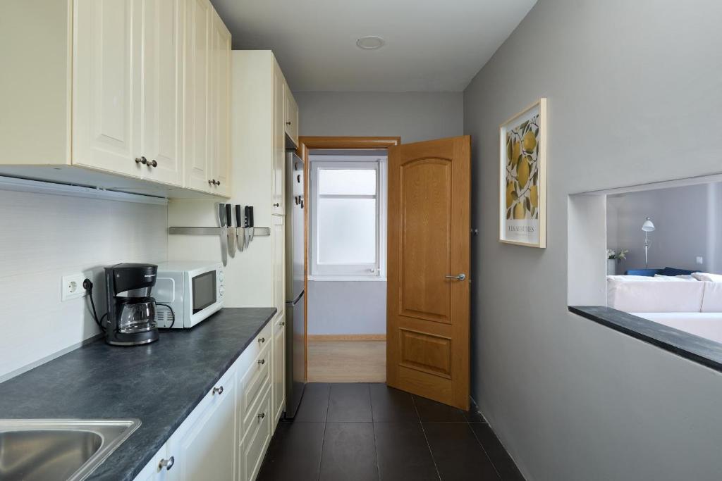 Kuchyň nebo kuchyňský kout v ubytování Casa Cosi - Casanova 5