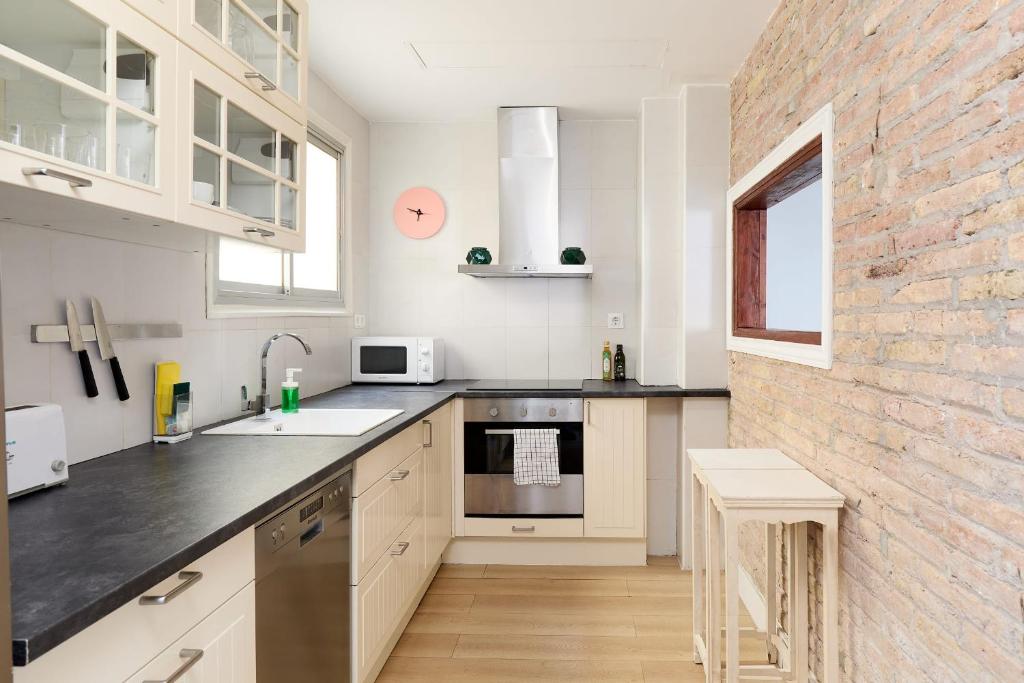 A kitchen or kitchenette at Casa Cosi - Casanova 6