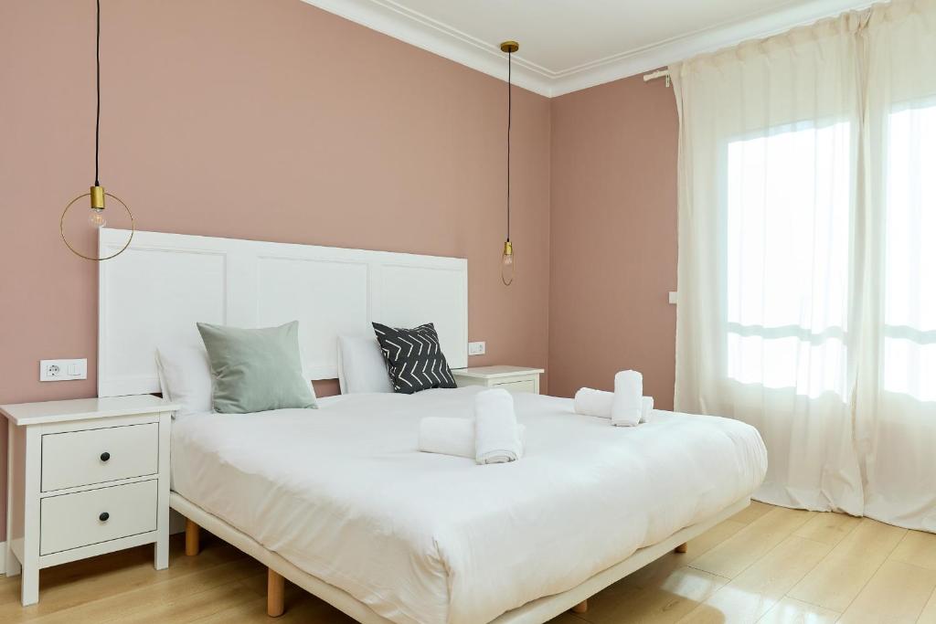 A bed or beds in a room at Casa Cosi - Casanova 6