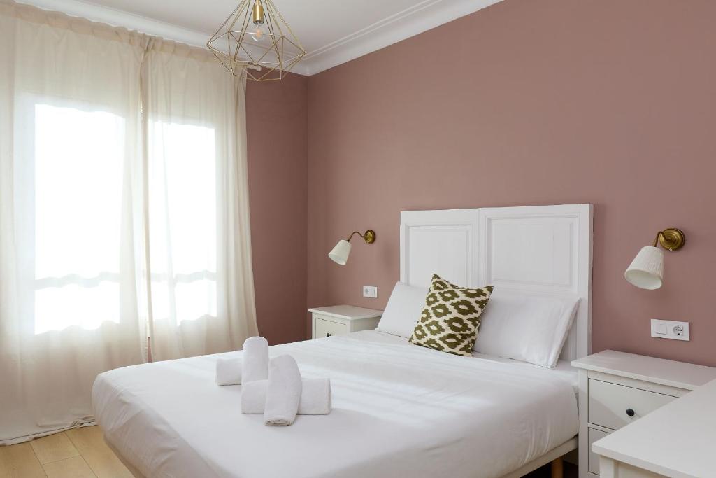 A bed or beds in a room at Casa Cosi - Casanova 6