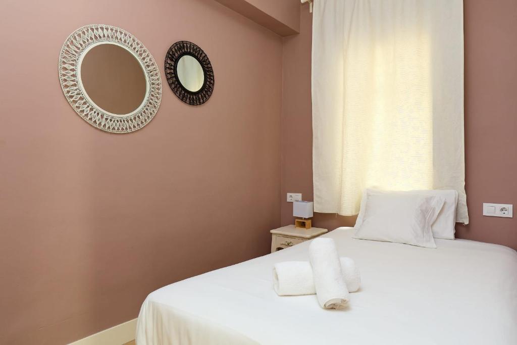 A bed or beds in a room at Casa Cosi - Casanova 6