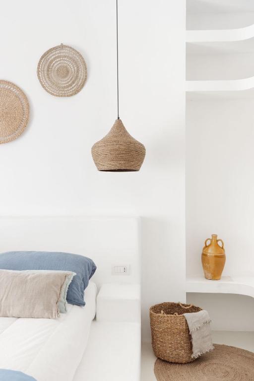 Postel nebo postele na pokoji v ubytování Sole Suites