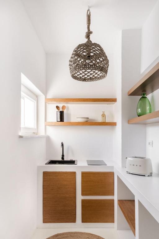 Kuchyň nebo kuchyňský kout v ubytování Sole Suites