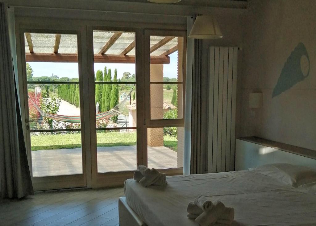 Postel nebo postele na pokoji v ubytování Fattoria Palazzeta - Pet & Family Friendly