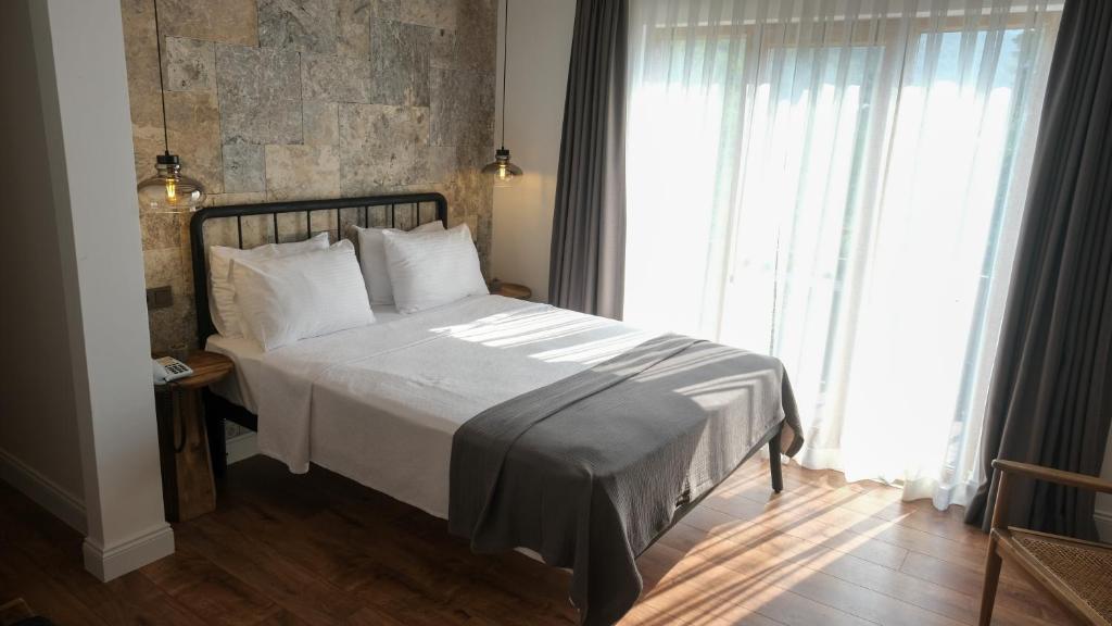 Postel nebo postele na pokoji v ubytování Cevizdibi Hotel