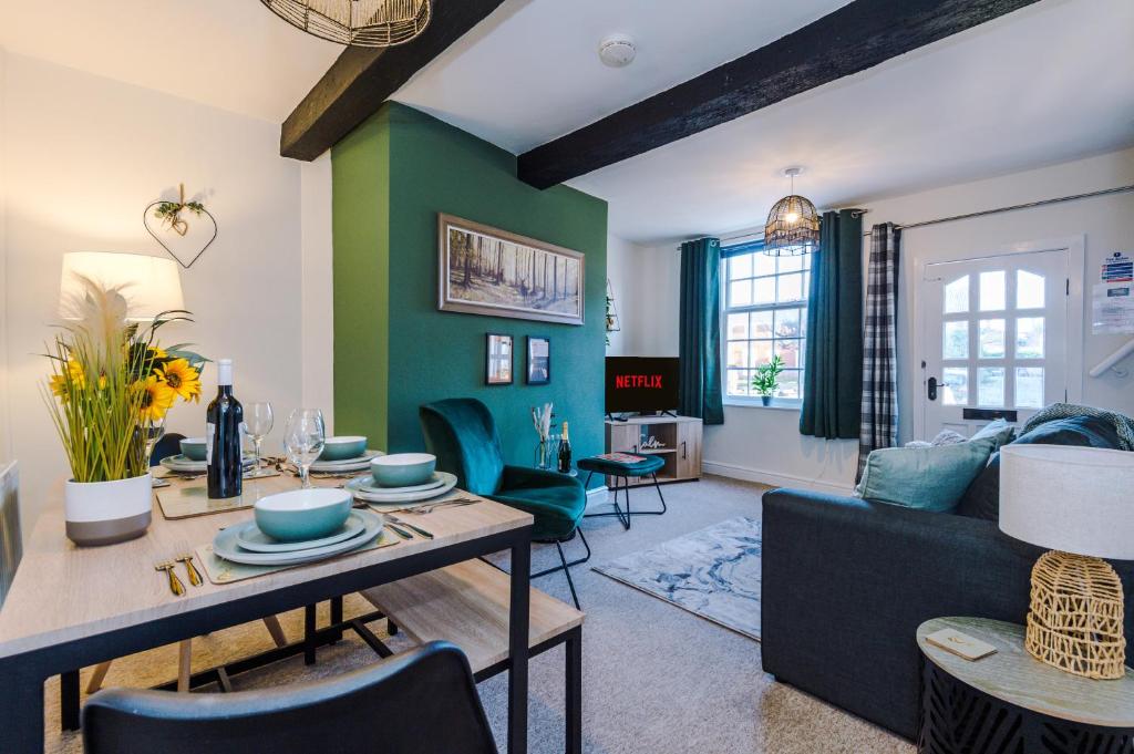 a living room with a couch and a table at Charming 1-bed house in Chester by 53 Degrees Property, Ideal for Couples & Business, Amazing Location - Sleeps 4 in Chester