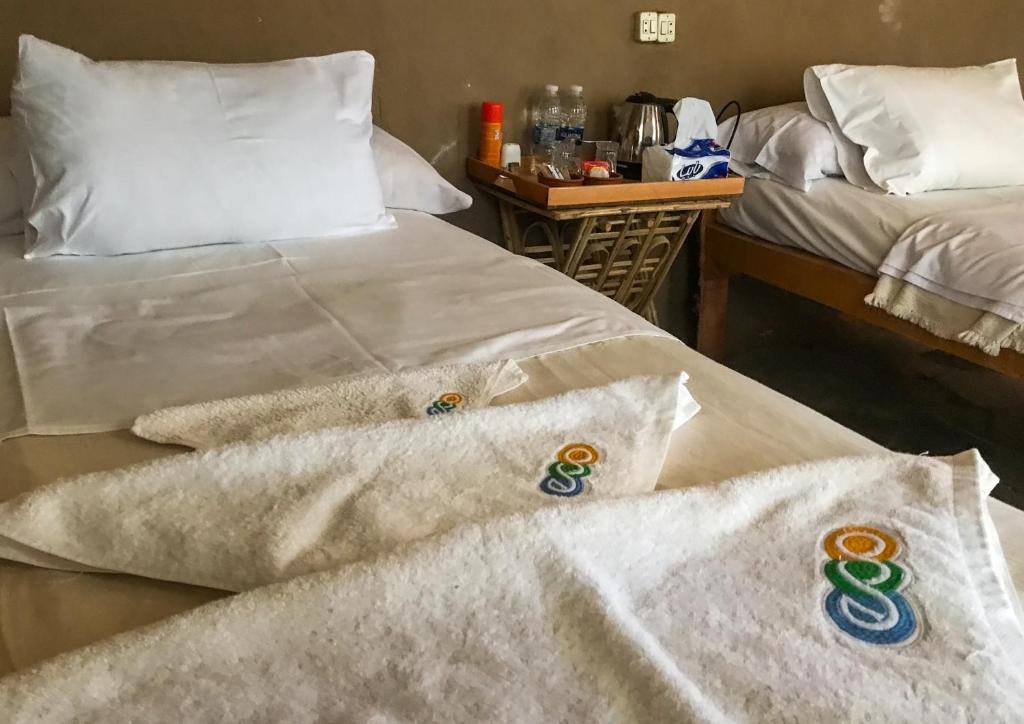 Postel nebo postele na pokoji v ubytování Eco Nubia