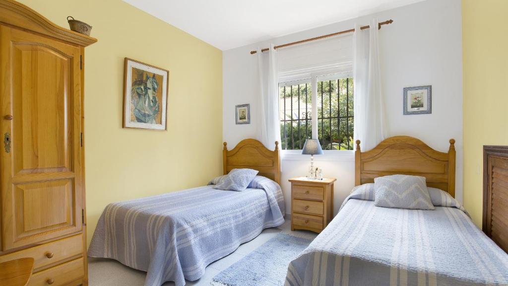 Postel nebo postele na pokoji v ubytování Villa Crisa - Lloret de Mar