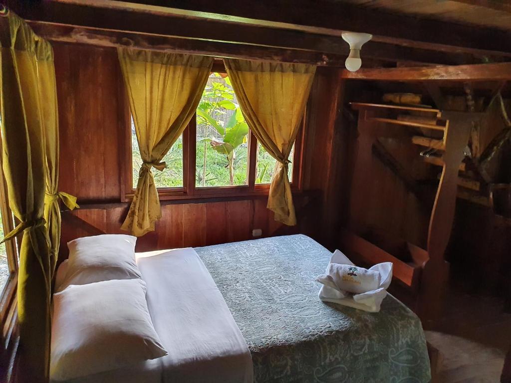 Postel nebo postele na pokoji v ubytování Finca Las Palmas Ecolodge