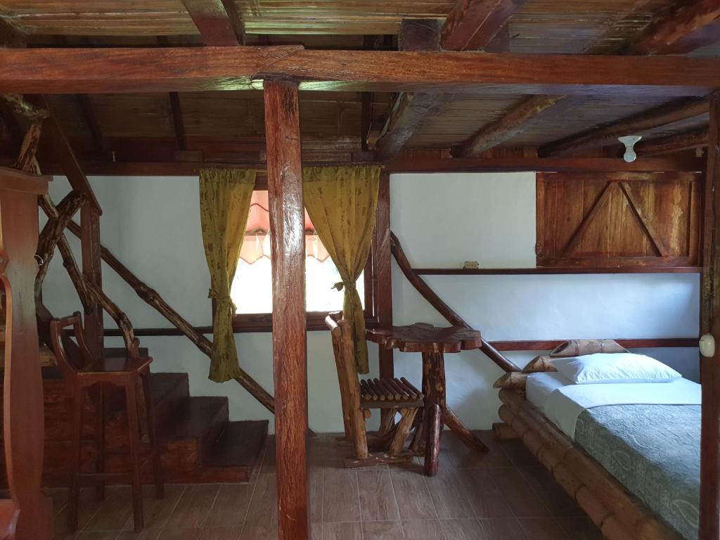 Postel nebo postele na pokoji v ubytování Finca Las Palmas Ecolodge