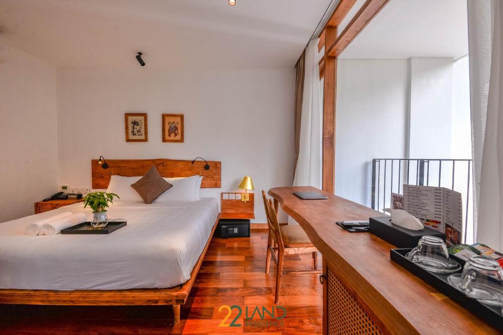 Postel nebo postele na pokoji v ubytování 22Land Hotel & Residence