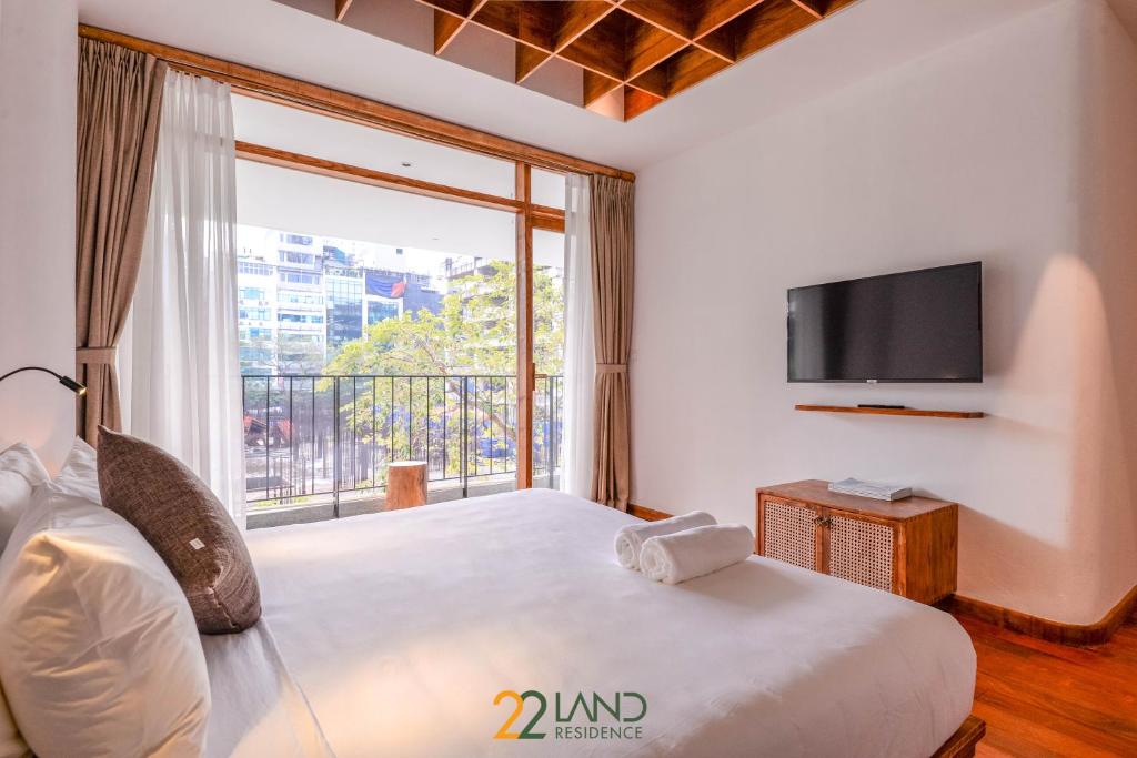 TV a/nebo společenská místnost v ubytování 22Land Hotel & Residence