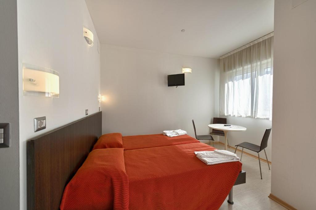 Postel nebo postele na pokoji v ubytování Hotel Sharing