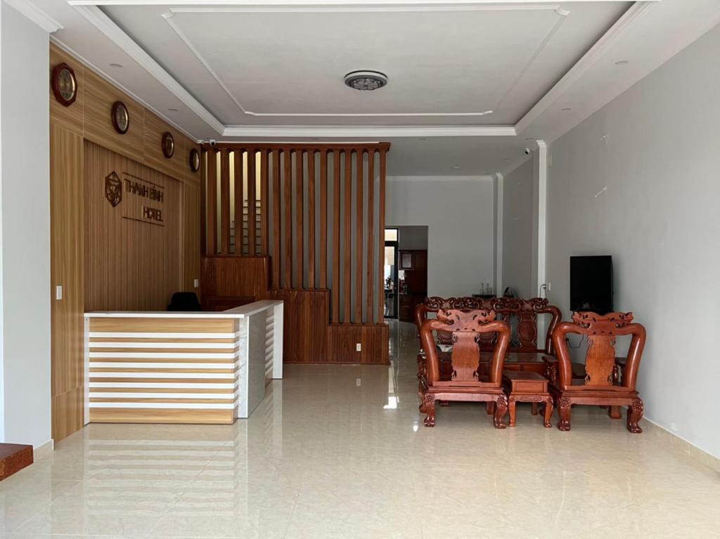 a living room with two chairs and a table at THANH BÌNH HOTEL, Bình Long in Binh Long