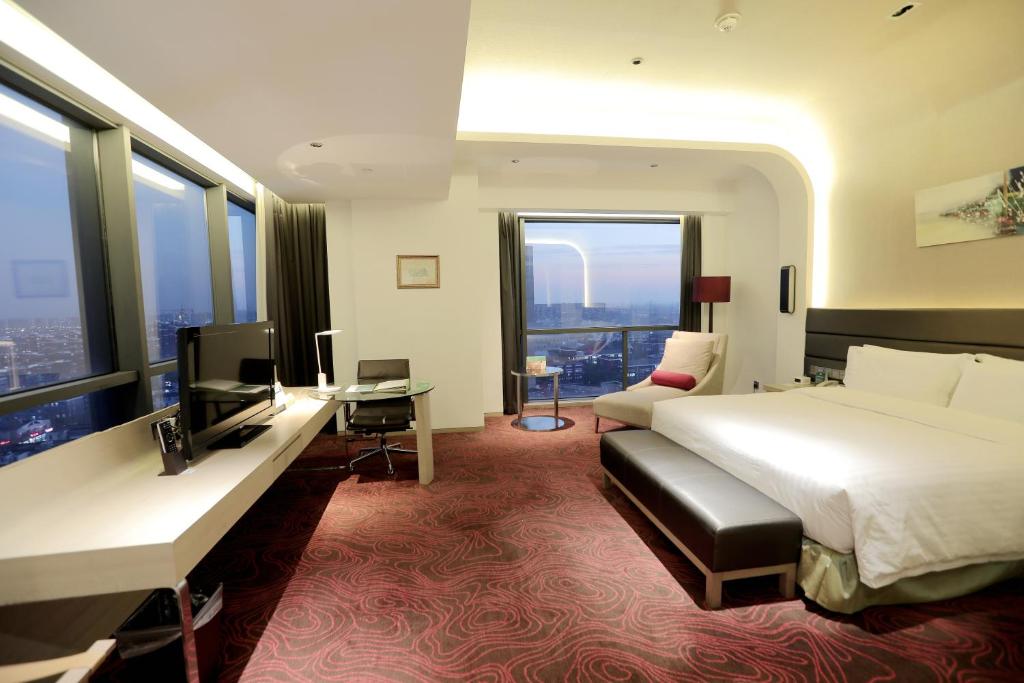 Postel nebo postele na pokoji v ubytování Holiday Inn Shanghai Songjiang by IHG - Miaoqian Street
