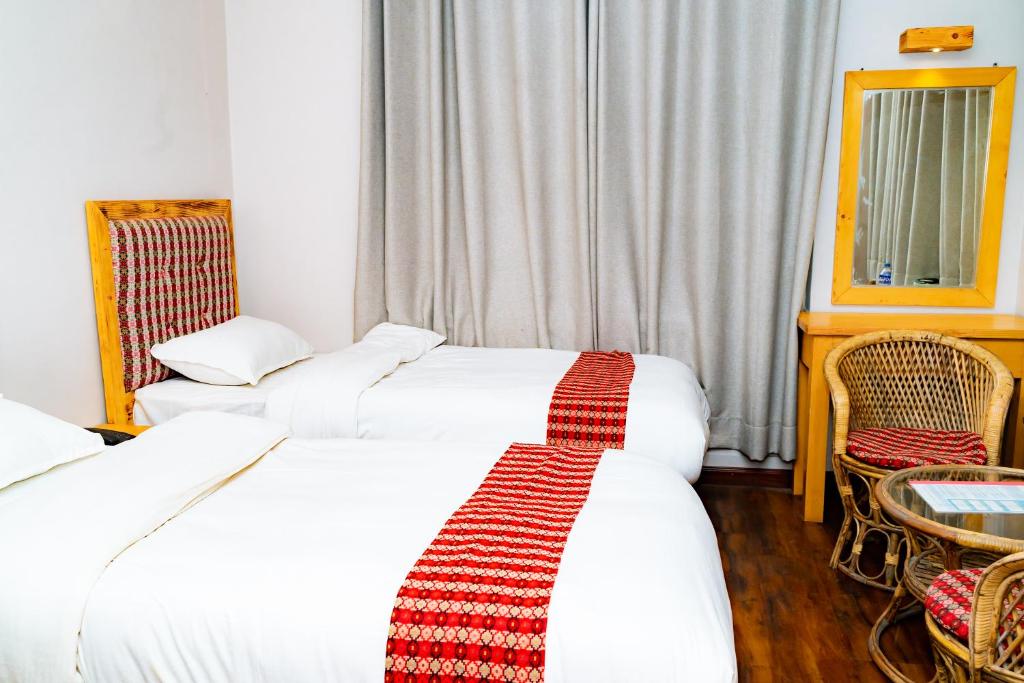 Postel nebo postele na pokoji v ubytování Silu Homes by Hostmandu