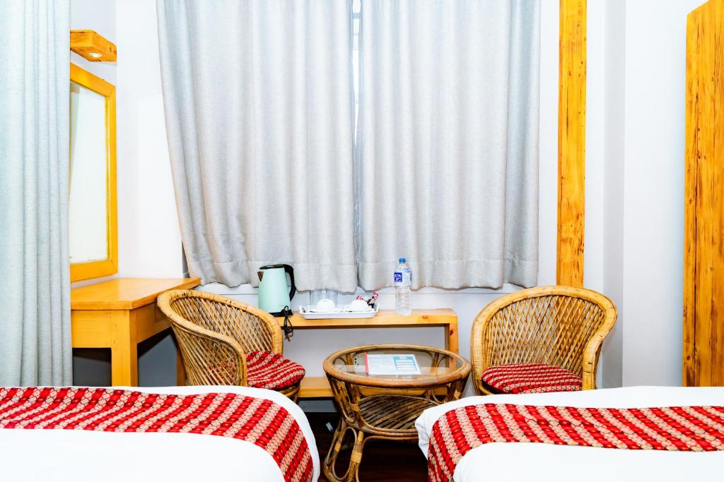 Postel nebo postele na pokoji v ubytování Silu Homes by Hostmandu