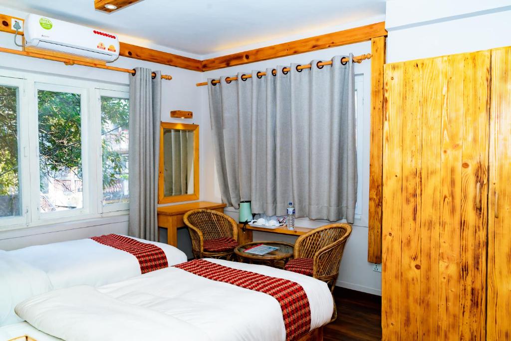 Postel nebo postele na pokoji v ubytování Silu Homes by Hostmandu