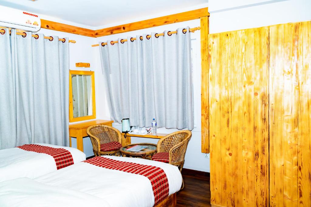 Postel nebo postele na pokoji v ubytování Silu Homes by Hostmandu