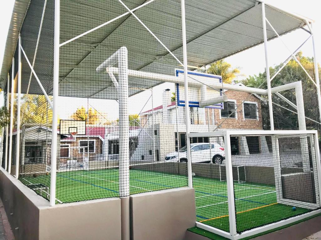 a batting cage with a tennis court in it at C&C HOTEL VIBES Randpark Ridge JHB 14 Units Available in Boskruin