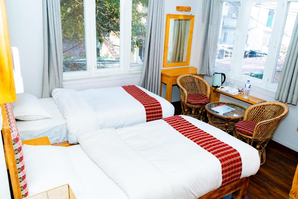 Postel nebo postele na pokoji v ubytování Silu Homes by Hostmandu