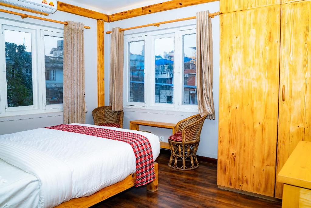 Postel nebo postele na pokoji v ubytování Silu Homes by Hostmandu