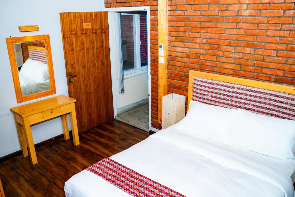 Postel nebo postele na pokoji v ubytování Silu Homes by Hostmandu