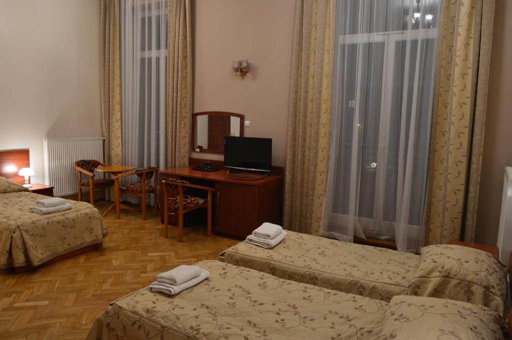 Posteľ alebo postele v izbe v ubytovaní Nowy Dom Zdrojowy