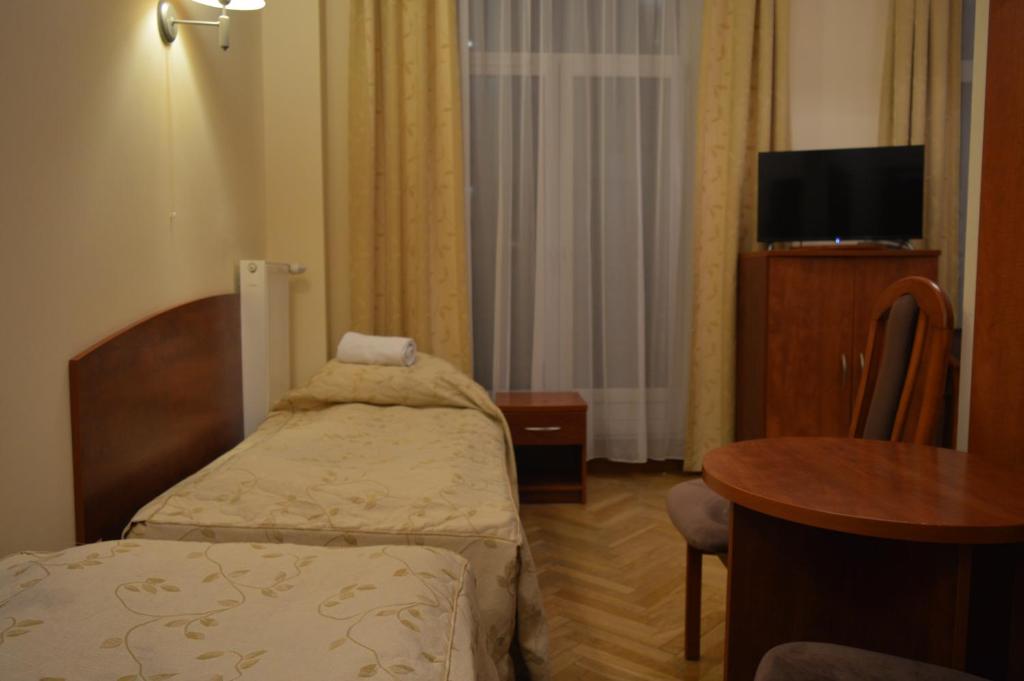 Posteľ alebo postele v izbe v ubytovaní Nowy Dom Zdrojowy
