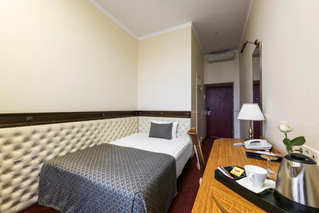 Postel nebo postele na pokoji v ubytování Congress Hotel
