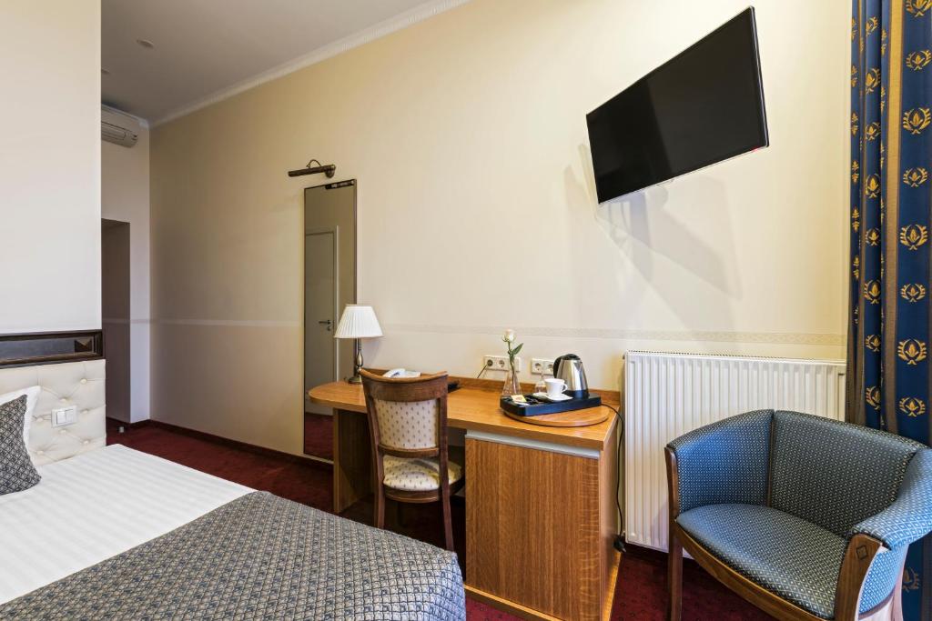 TV a/nebo společenská místnost v ubytování Congress Hotel
