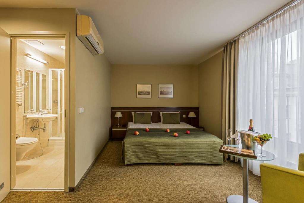 Postel nebo postele na pokoji v ubytování Congress Hotel