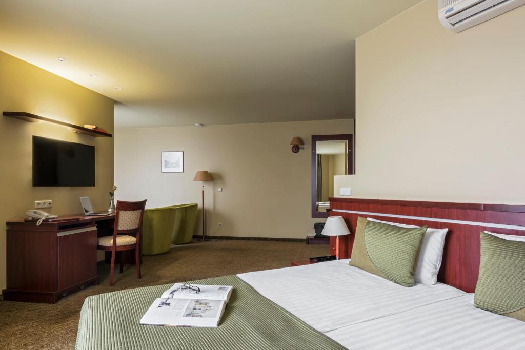 Postel nebo postele na pokoji v ubytování Congress Hotel